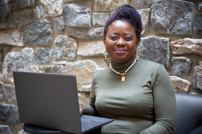 Person sitting with laptop