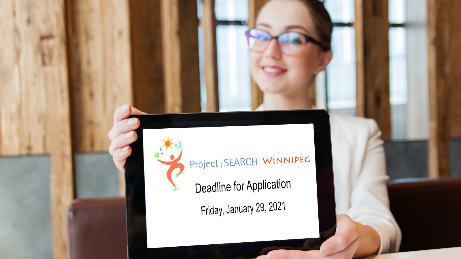 Person holding a tablet that says Project Search Winnipeg Deadline for Application Friday, January 29th, 2021